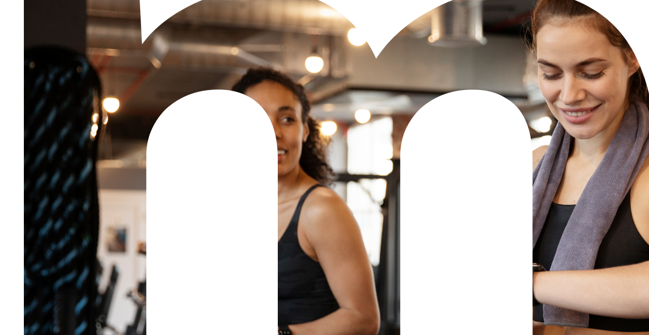 Trainer Priya Shah smiling in the studio